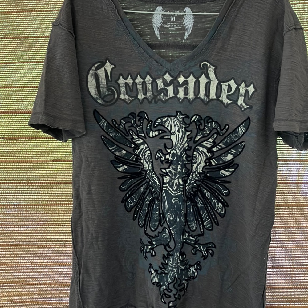 Crusader tee by Carbon Black. Short sleeve. Outline is actually a raised flock.